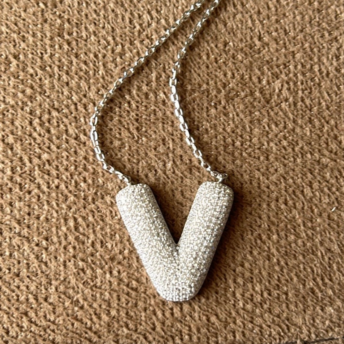 Letter V necklace in silver