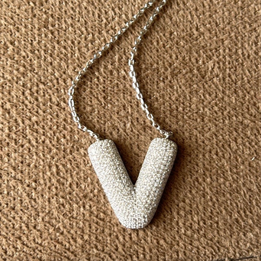 Letter V necklace in silver